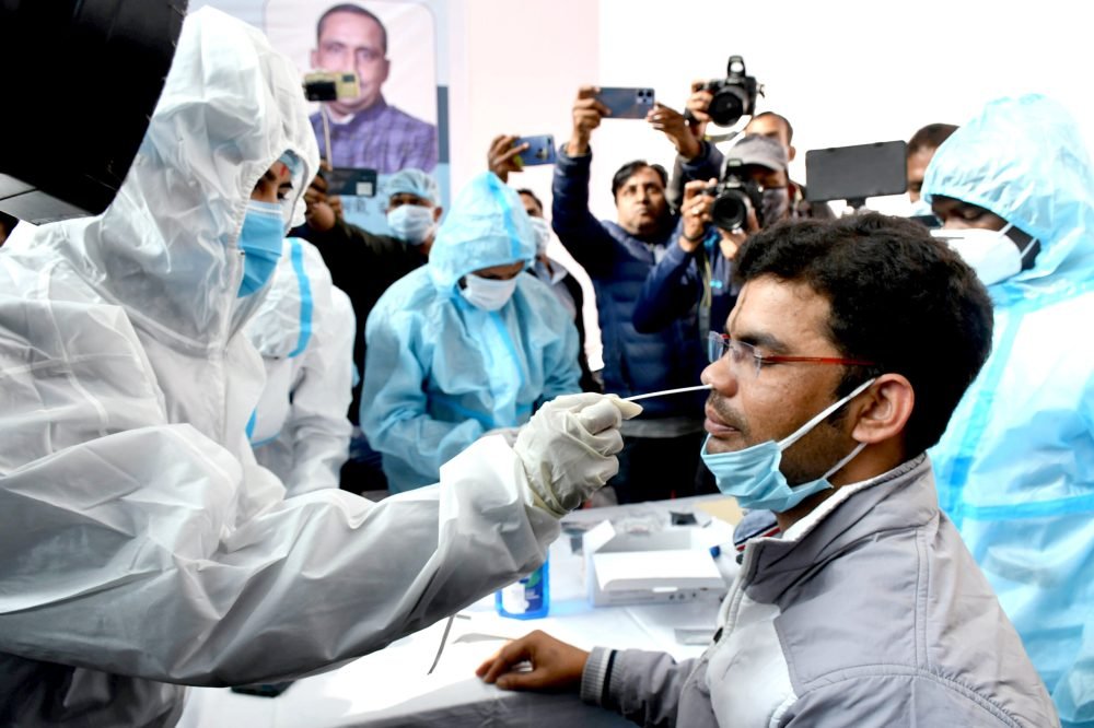 Ranchi, Dec 27 (ANI): A healthcare worker collects a nasal swab sample of a man during the COVID-19 mock drill conducted to ensure Covid management preparedness in view of the rising cases of Coronavirus in some countries including China, at Sadar Hospital, in Ranchi on Tuesday. (ANI Photo)