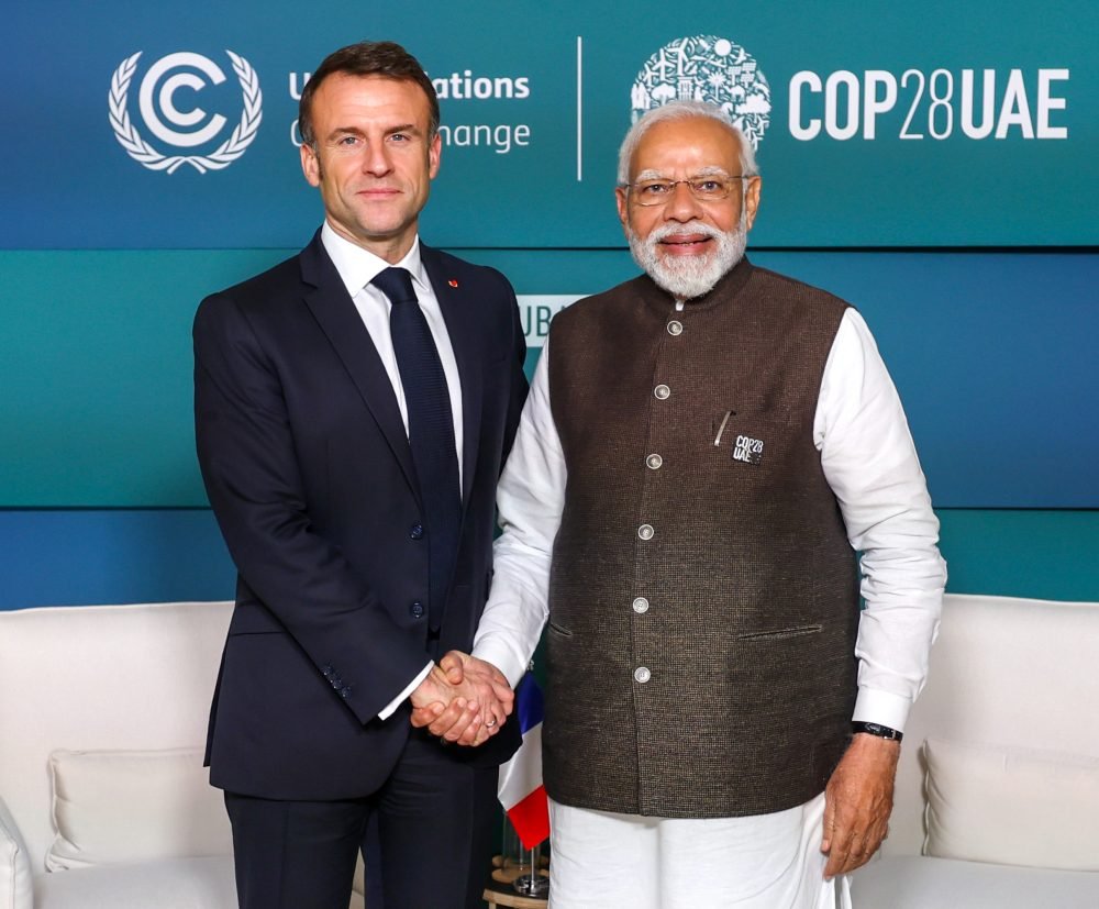 Dubai, Dec 1 (ANI): Prime Minister Narendra Modi meets with French President Emmanuel Macron, in Dubai on Friday. (ANI Photo)