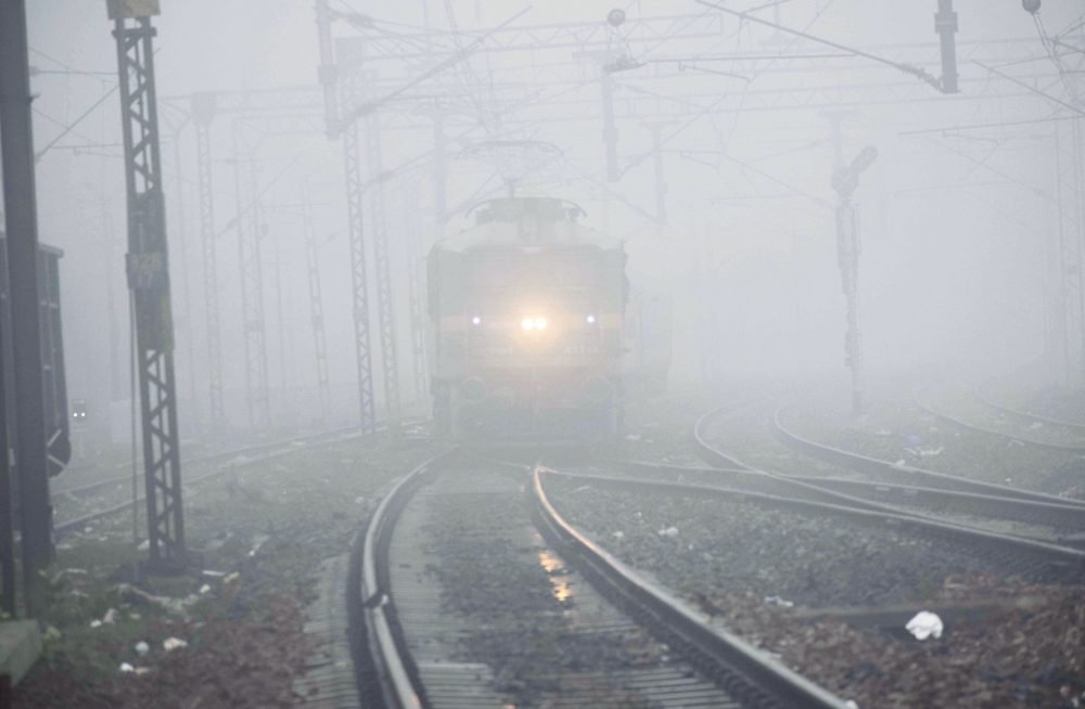 Prayagraj, Dec 02 (ANI): A train running slow due to dense fog on a cold morning during the winter season, in Prayagraj on Saturday. (ANI Photo)