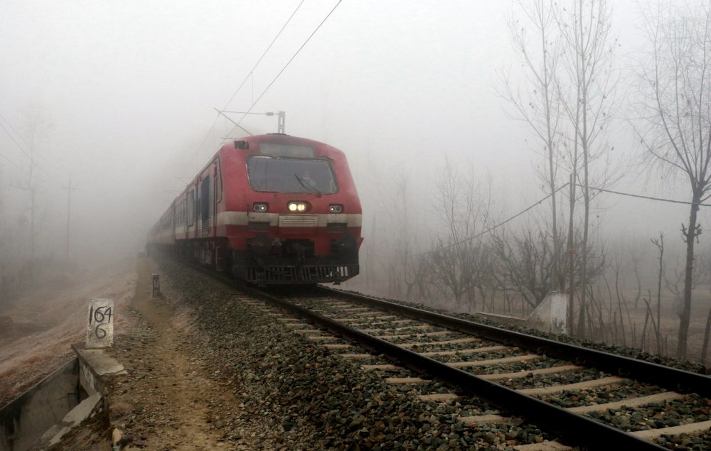 Dense fog engulfs Srinagar Srinagar, Dec 29 (ANI): A train runs on a railway track amid low visibility due to dense fog on a cold winter day, in Srinagar on Friday. (ANI Photo)